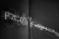 Black and white abstract art with text on a dark background by Alta Mihartescu