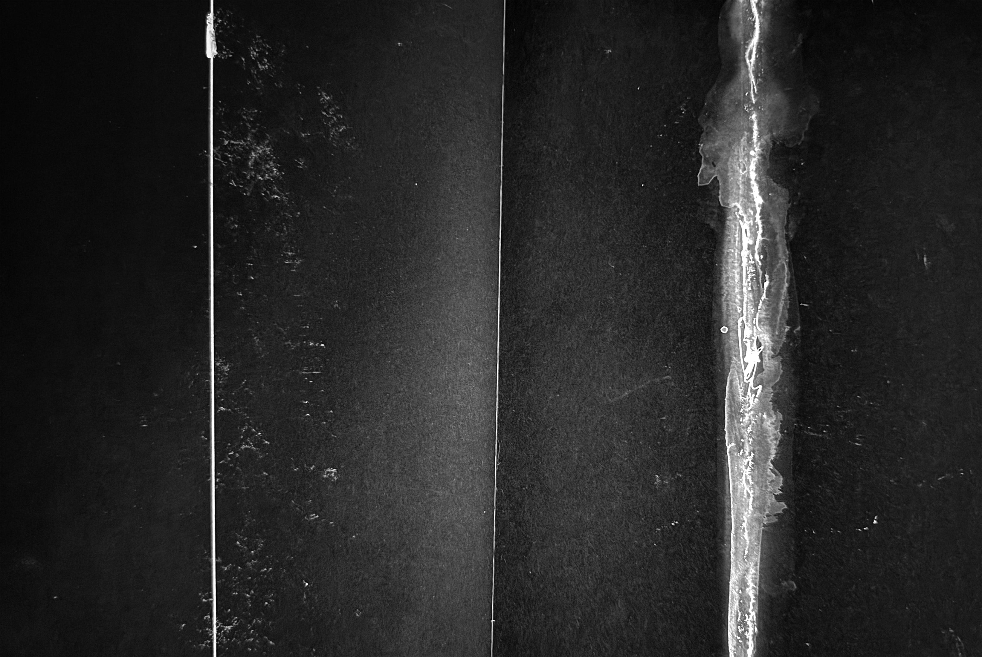 Close-up of a knife blade with a dark background by Alta Mihartescu